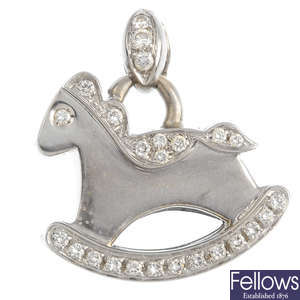 A diamond rocking horse charm.