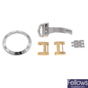 CARTIER - a group of assorted parts and bracelet links.