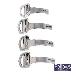 CARTIER - a group of four stainless steel deployant clasps.
