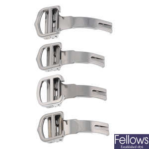 CARTIER - a group of four stainless steel deployant clasps.