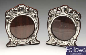 A pair of Art Nouveau silver mounted photograph frames.