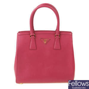PRADA - a fuchsia pink Saffiano leather handbag.