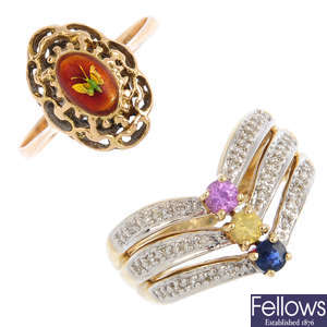 Five gem-set and diamond rings.