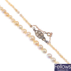 A pearl and diamond single-strand necklace.