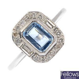 An aquamarine an diamond cluster ring.