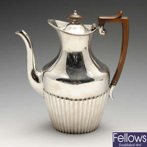 A late Victorian silver coffee pot.