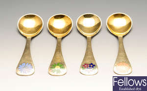 A part set of four modern Danish silver-gilt year spoons by Georg Jensen.