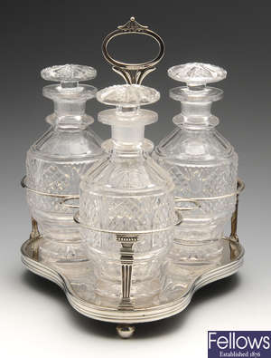 A George III silver mounted decanter stand of triform.