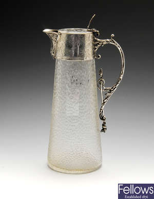 A late Victorian silver mounted oval glass claret jug.