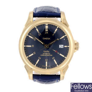 OMEGA - a gentleman's 18ct yellow gold De Ville GMT Co-Axial wrist watch.