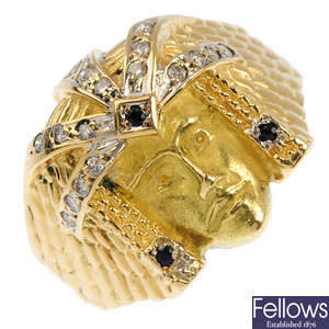 A 14ct gold diamond and sapphire pharaoh ring.