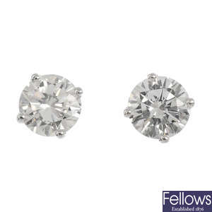 A pair of 18ct gold brilliant-cut diamond stud earings.