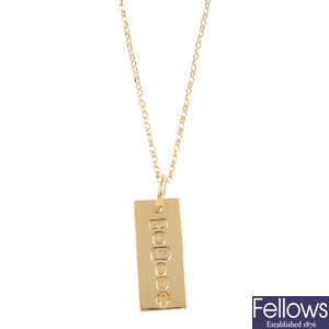 A 9ct gold ingot pendant, with chain.