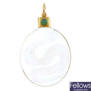 A rock crystal and emerald pendant.