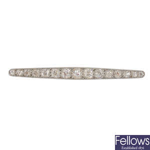 An early 20th century platinum and 18ct gold diamond bar brooch.