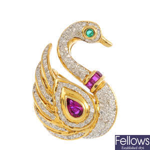 An 18ct gold diamond, ruby and emerald swan brooch.