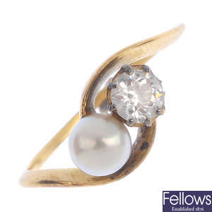 A diamond and natural pearl crossover ring.
