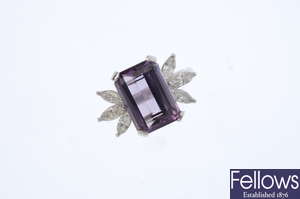 An amethyst and diamond cocktail ring.