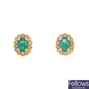 A pair of 18ct gold emerald and diamond stud earrings.