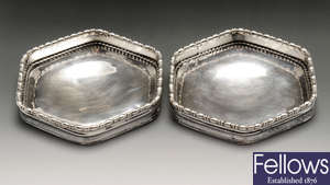 A pair of Arts & Crafts silver pin dishes by Omar Ramsden.