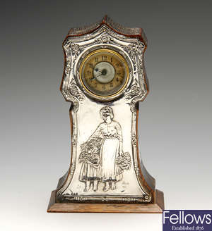 An Edwardian silver mounted wooden clock.