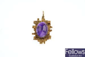 A pair of 1970s amethyst earrings and pendant set.