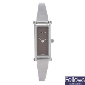 GUCCI - a lady's stainless steel 1500L bracelet watch with two Gucci watches.