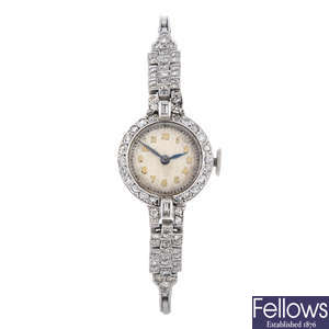 A white metal lady's cocktail watch.