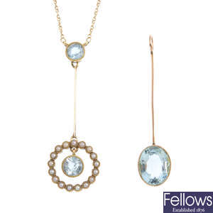 Two early 20th century gold aquamarine pendants.