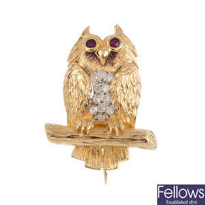 A 9ct gold diamond and ruby owl brooch.