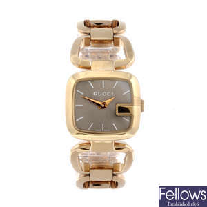 GUCCI - a lady's gold plated 125.5 bracelet watch together with a Gucci wrist watch