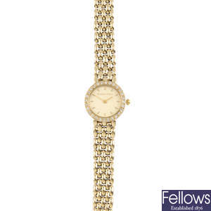 BUECHE GIROD - a 9ct gold diamond watch.