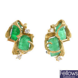 A pair of emerald and diamond earrings.