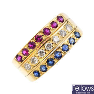 A ruby, sapphire and diamond three-row ring.
