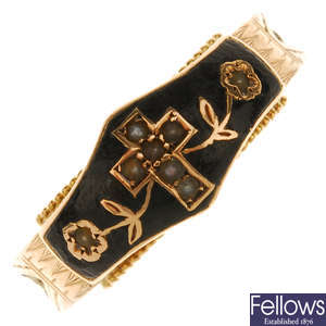 An early 20th century 9ct gold enamel and split pearl memorial ring.