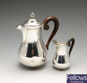 A late nineteenth/early twentieth century French silver coffee pot and cream jug.