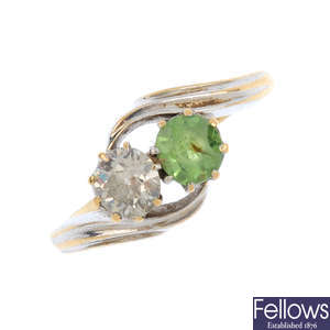 An 18ct gold diamond and green-gem two-stone ring.