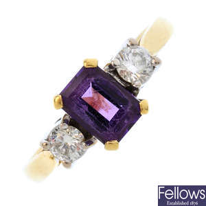 An 18ct gold amethyst and diamond three-stone ring.