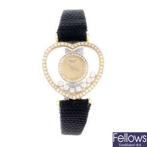 CHOPARD - a lady's factory diamond set yellow metal Happy Diamonds wrist watch.