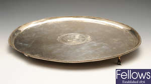A George III silver salver of oval form (in need of repair and restoration).