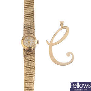 A ladies wrist watch and a pendant.