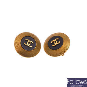 CHANEL - a pair of round logo ear clips.