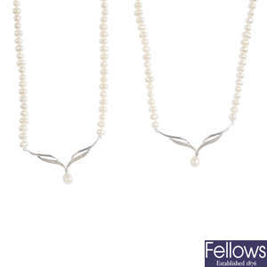 Four cultured pearl and diamond single-strand necklaces.
