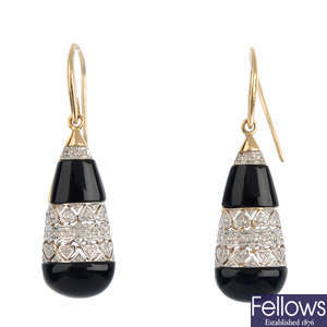 A pair of diamond and onyx earrings.