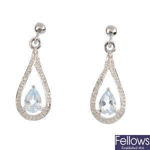 A pair of 9ct gold aquamarine and diamond cluster earrings.