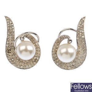 (551272-6-A) A pair of diamond and imitation pearl earrings.