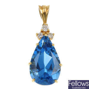 (549810-3-A) An 18ct gold topaz and diamond pendant.