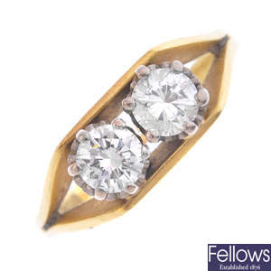 An 18ct gold diamond two-stone ring.