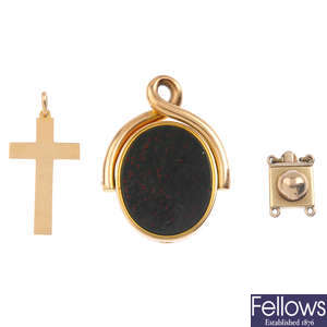 A 1920s 15ct gold cross, a gold clasp and a Victorian 15ct gold fob.