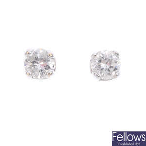 A pair of 9ct gold brilliant-cut diamond stud earrings.